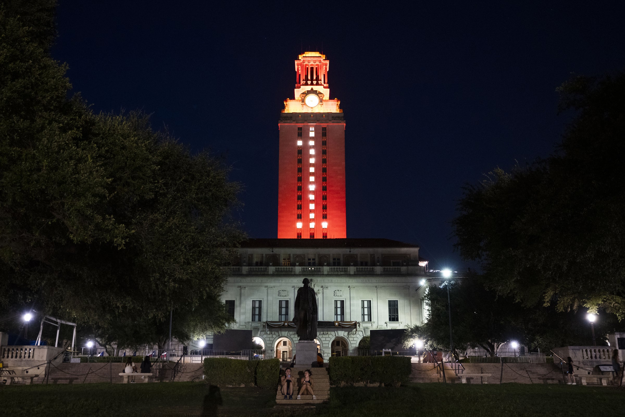 Photo of the UT Tower lit burnt orange with windows lit to form the number &quot;1&quot;