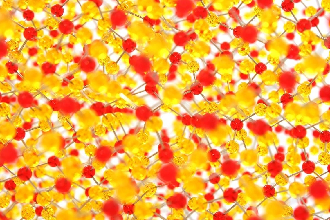 A multilayered rendering of atoms and molecules of varying colors suggests a complex structure at work.