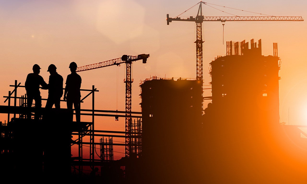 Construction workers at a plant