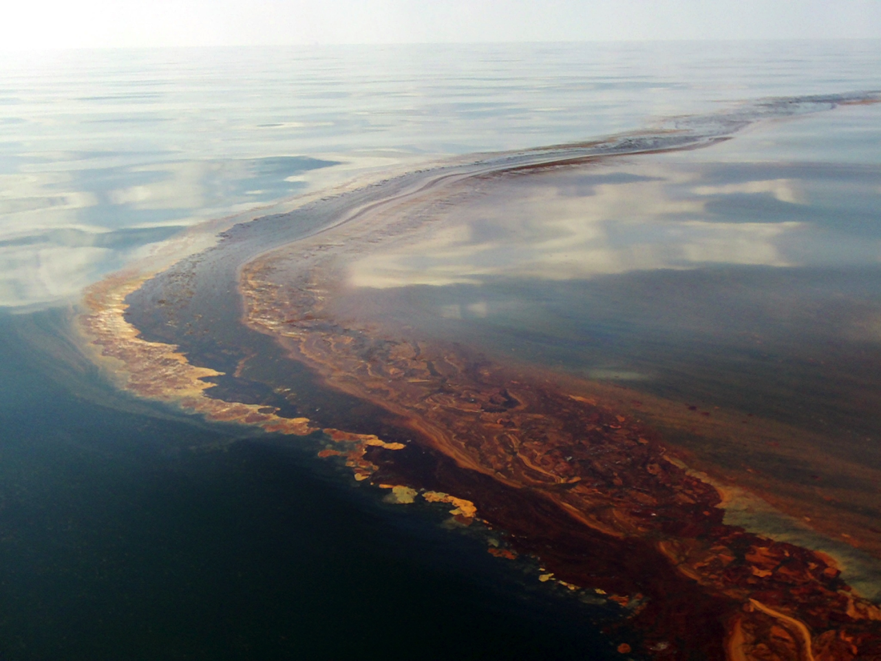 An Oil Slick stretches across a span of ocean