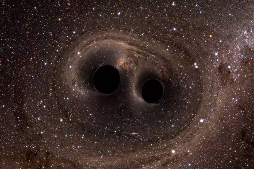 Artists rendition of two black holes about to collide in space