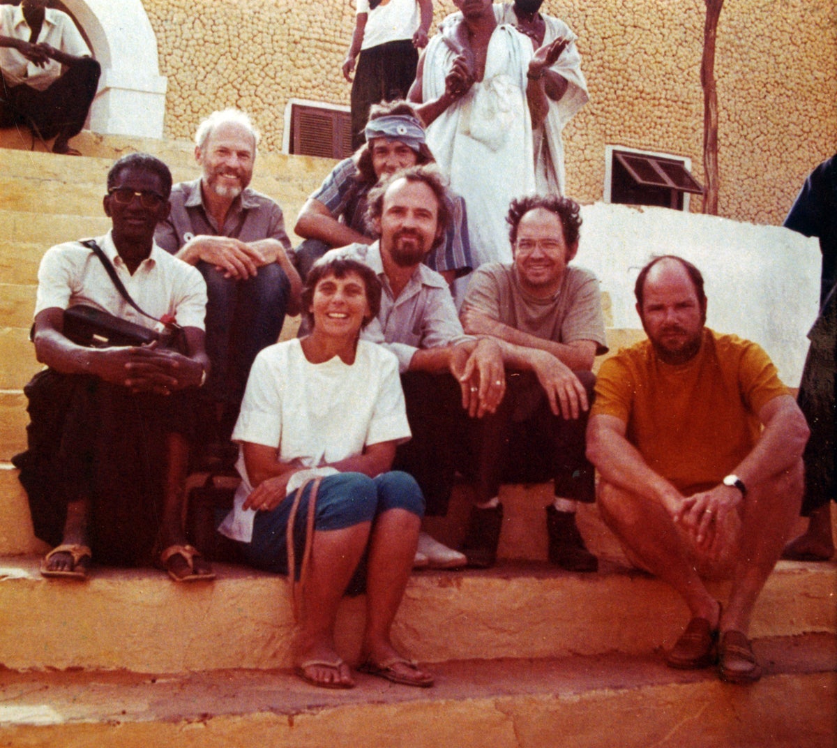 Cécile Dewitt-Morette with team of UT physicists (including husband Bryce Dewitt, back left) in Mauritania in 1973.