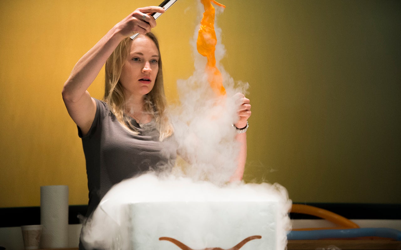 Tess Bernard demonstrates what happens when air in a balloon is cooled in liquid nitrogen.