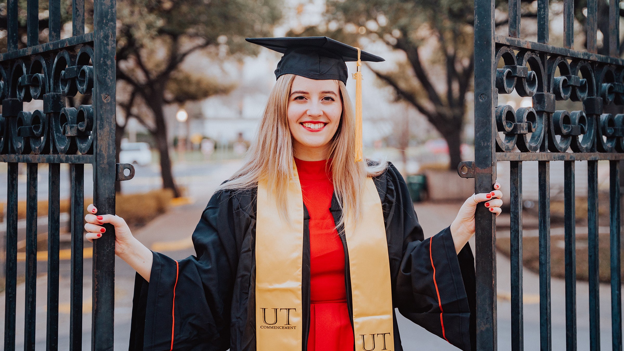 A young woman in a graduation gown