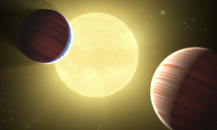 artist rendering of a star with two planets