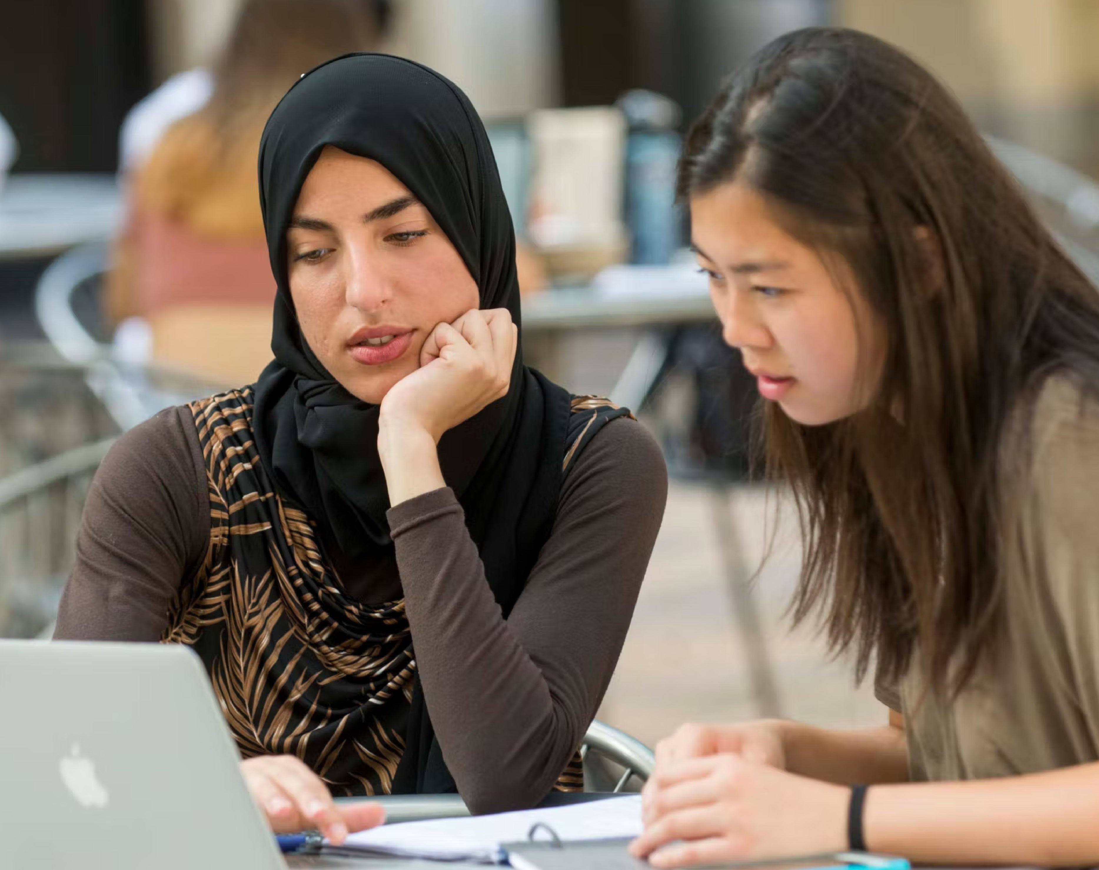 two women looking at laptop