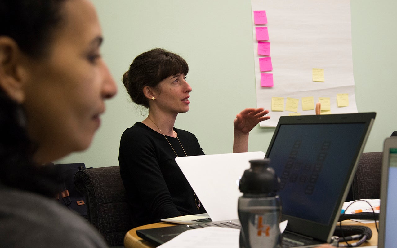 Stacia Rodenbusch of UT Austin discusses the FRI program at a meeting.