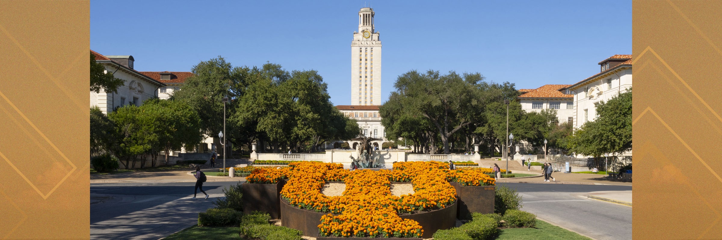 Photo of UT Tower with flowerbed in foreground.