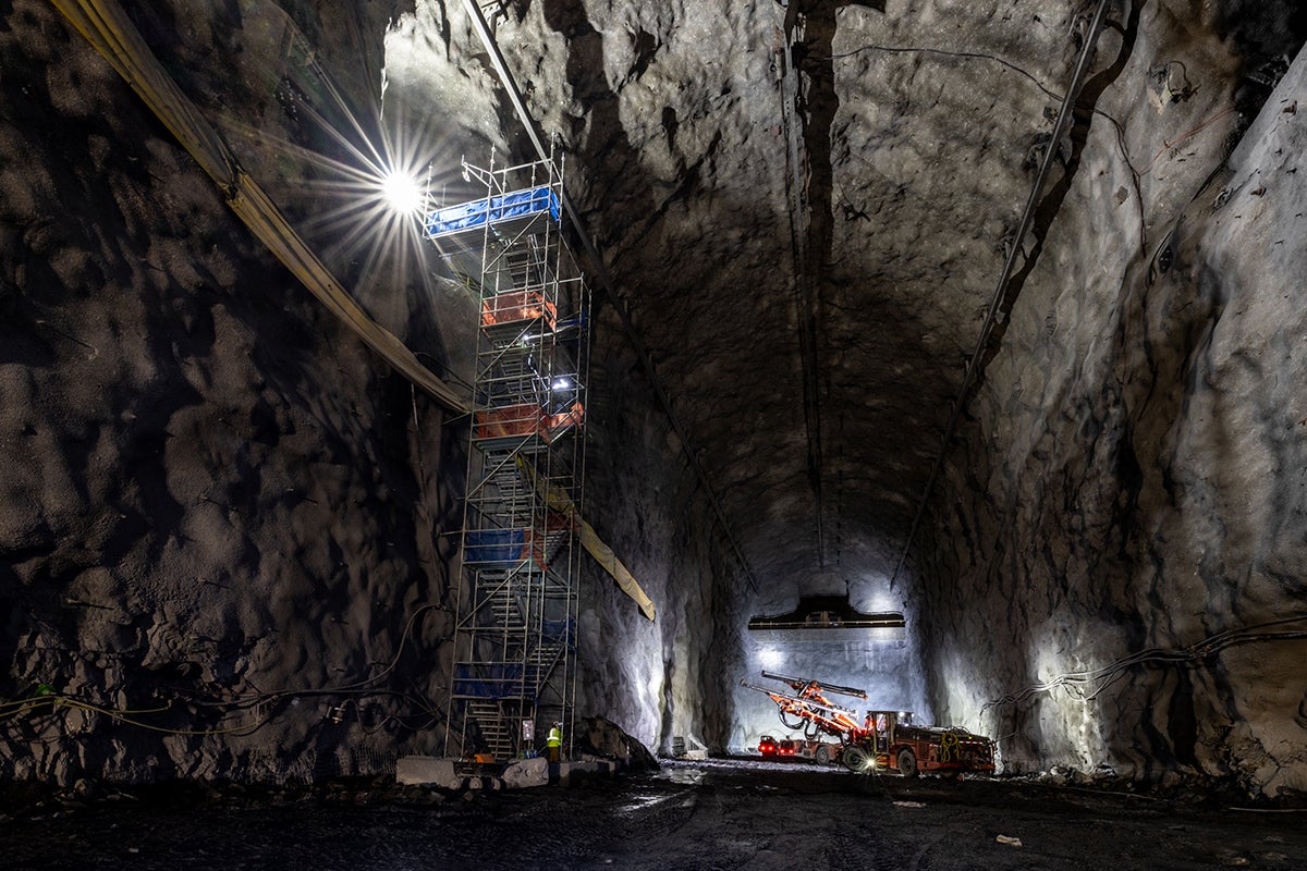 Cranes and other large equipment working in a large cavern