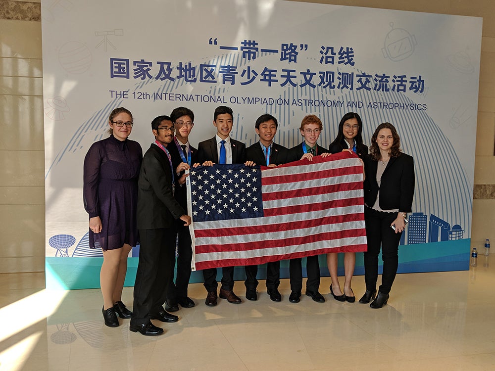 The USA Team in Beijing. From left to right: Ioana Zelko (Team Leader), Sahil Pontula, Vincent Brian, David Yue (also a Texan), Andy Zhu, Texan and gold medalist Joseph McCarty, April Cheng and UT Austin graduate student Nastasa Dragovic (Team Leader). Photo from the USAAAO.