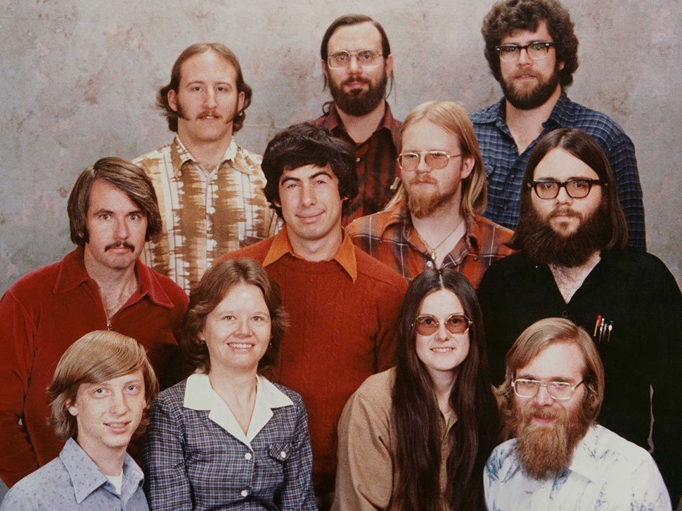 Group portrait of 11 men and women from the 1970s 