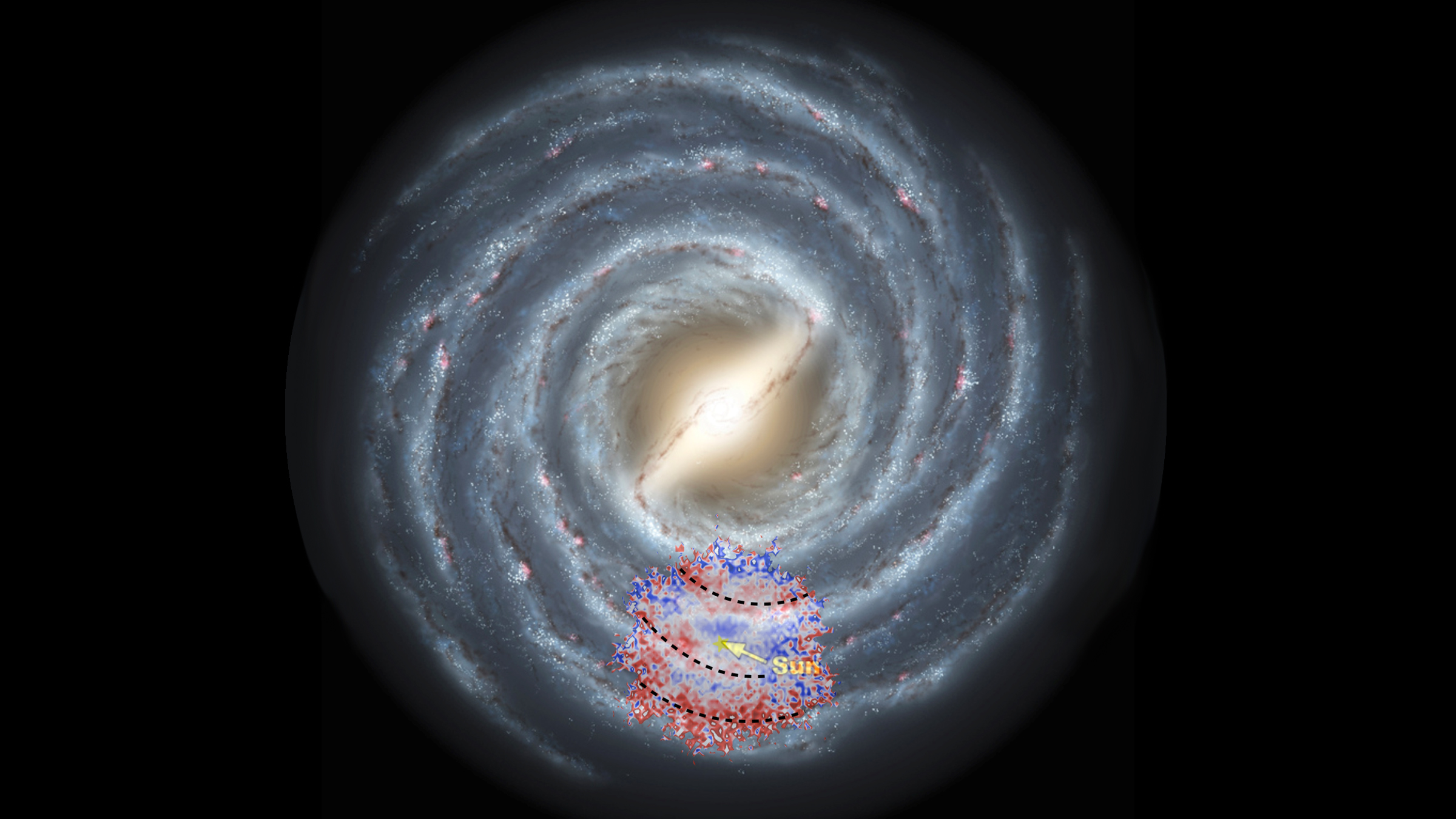 A spiral galaxy floats in the black background of space with red and blue dots sprinkled over one section