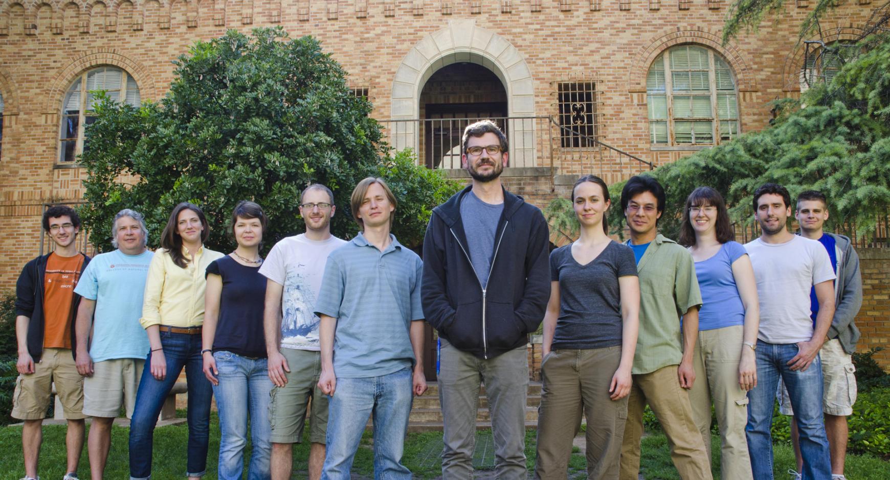 People standing in front of brick building