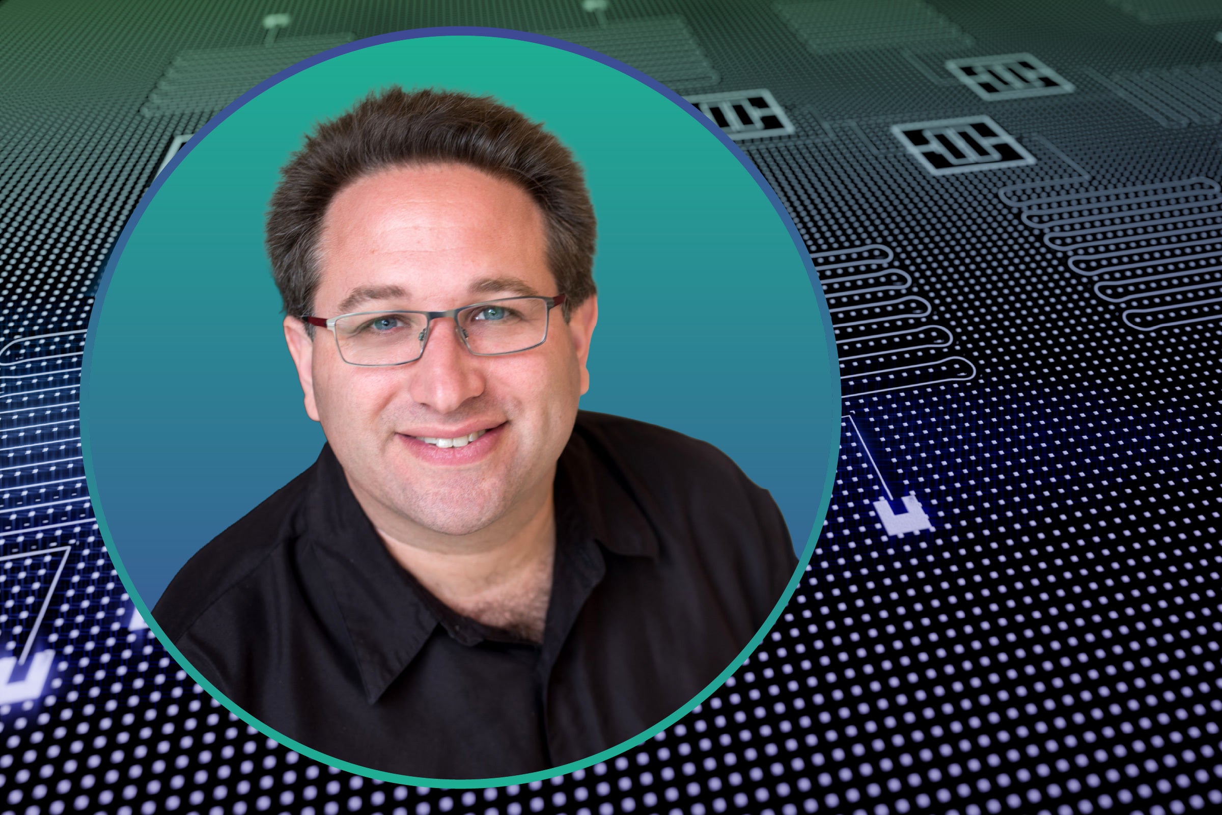 Portrait of a scientist with glasses. In the background is a computer integrated circuit board.