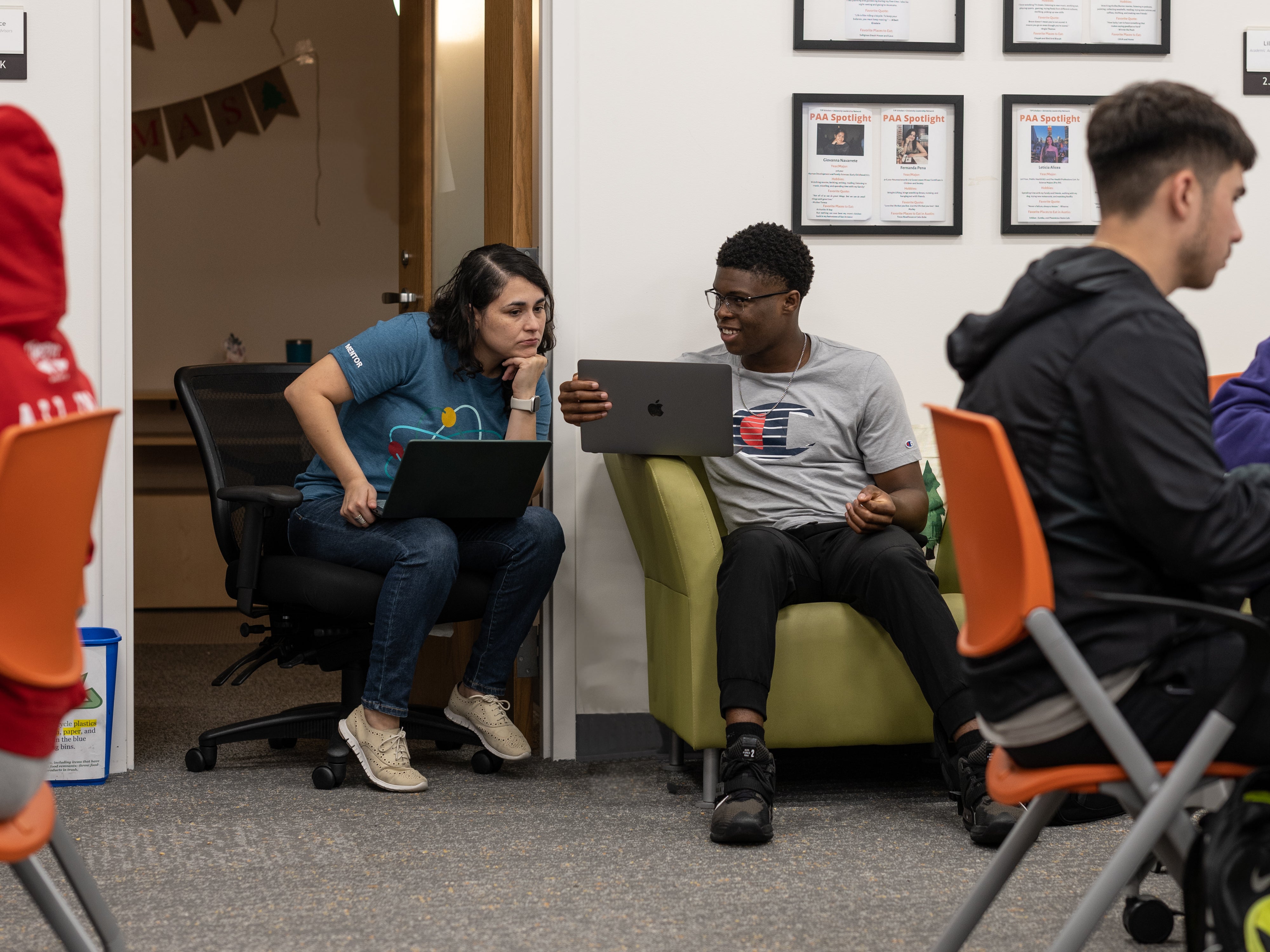 Student and Advisor in discussion over a laptop