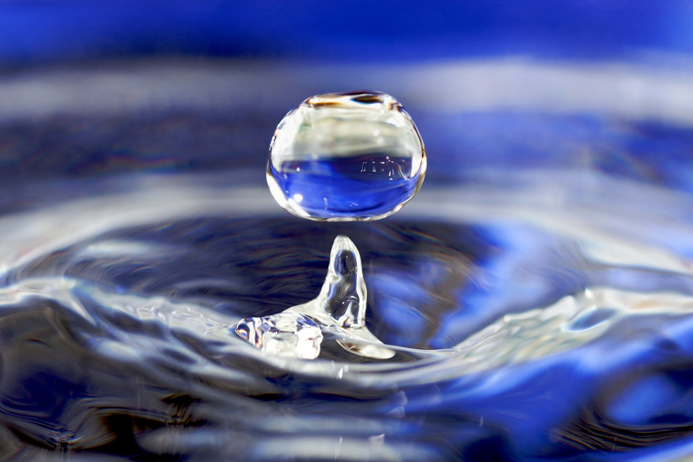 A globule of liquid water, and the concave depression and rebound in water caused by something dropping through the water surface. Water DropletSource: Flickr [http://www.flickr.com/photos/josjos/2631718740/]. Licensing: Cc-by-2.0. Author: José Manuel Suárez. Taken: 02–July–2008.